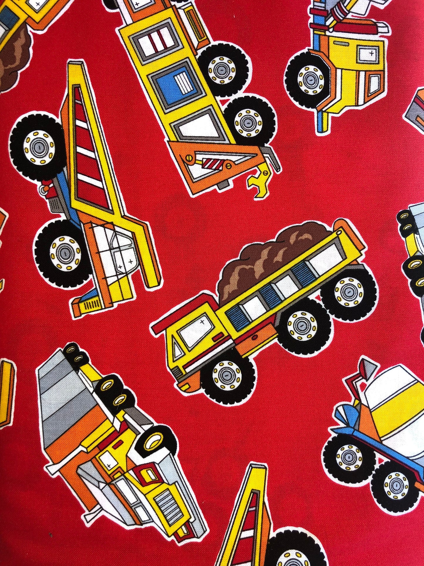 Trucks on Red from Kanvas Under Construction cotton fabric