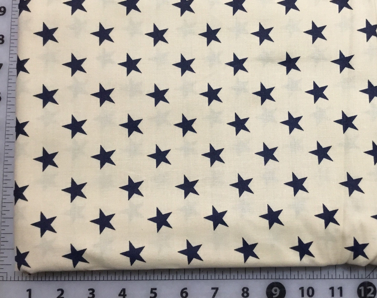 Blue Stars on Cream Background Patriotic Cotton Fabric from Checker Distibutors