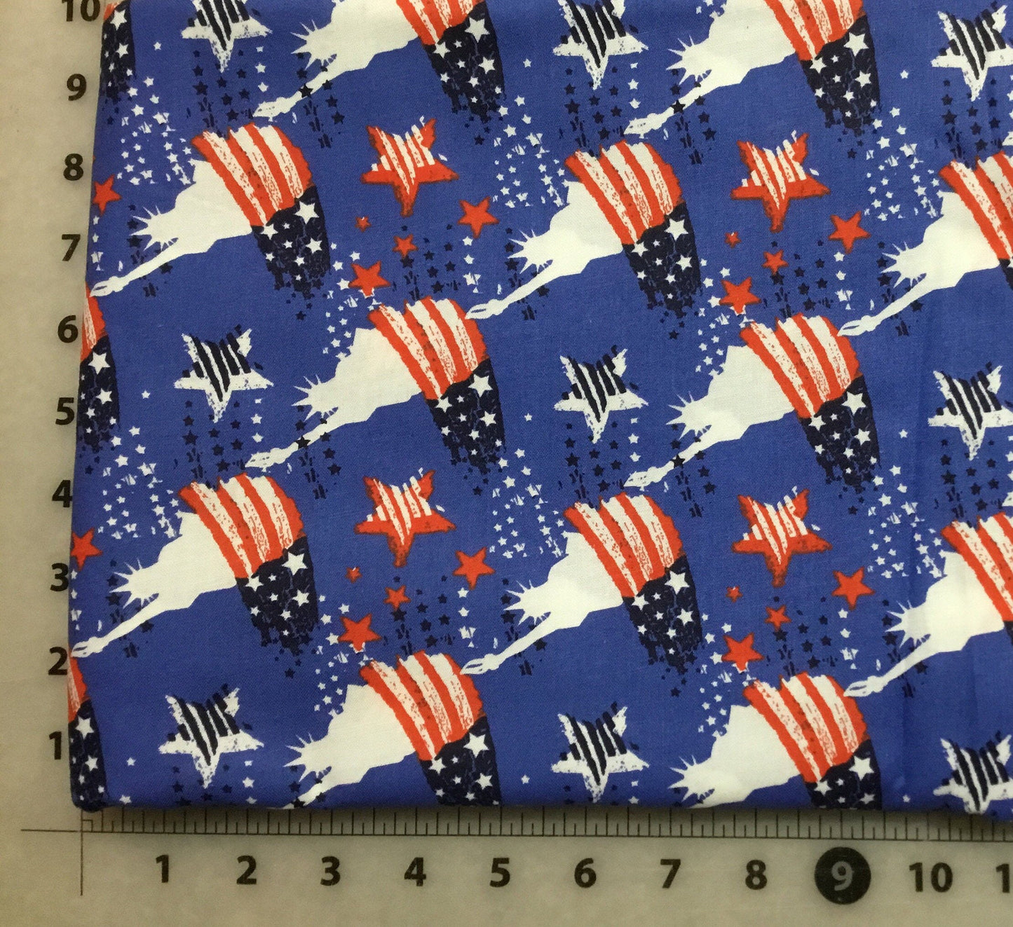 Statue of Liberty and Stars on blue background Patriotic Cotton Fabric from Checkers Fabrics